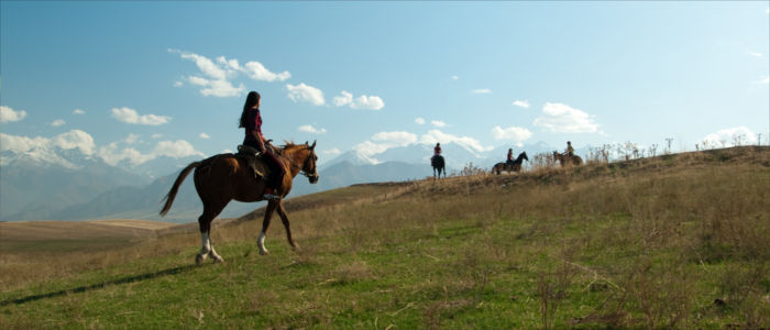 Unterwegs auf dem Pferd in Kirgisistan